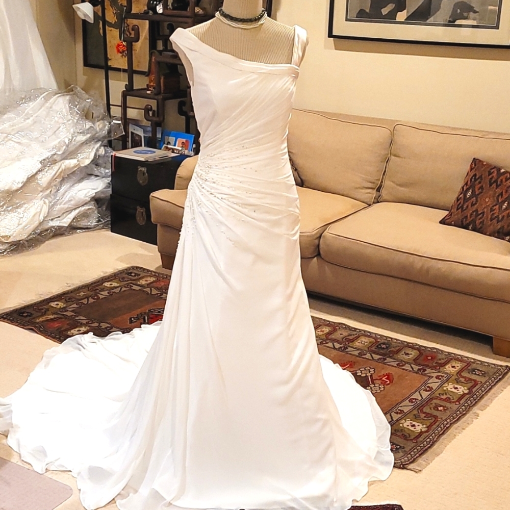 Asymmetrical gathered chiffon over satin bridal gown